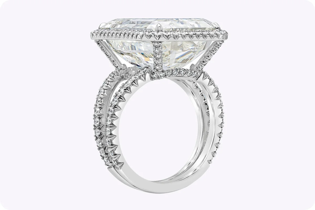 A Short History of the Engagement Ring 3. 20.21 carat emerald cut diamond engagement ring with halo in platinum, Deco geometry