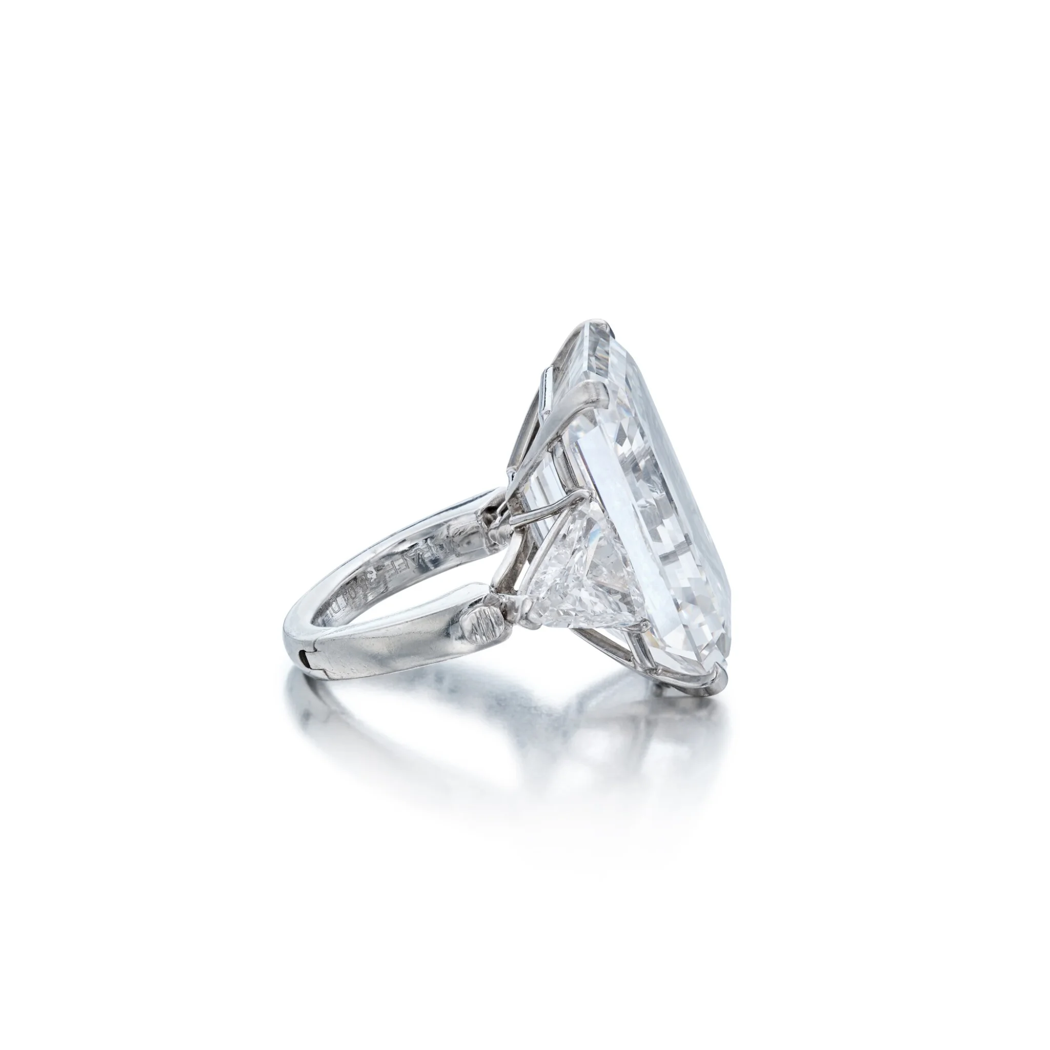 Emerald Cut vs. Round Brilliant: The Honest Comparison 2. 20 carat emerald cut diamond ring showing long step facets, closeup