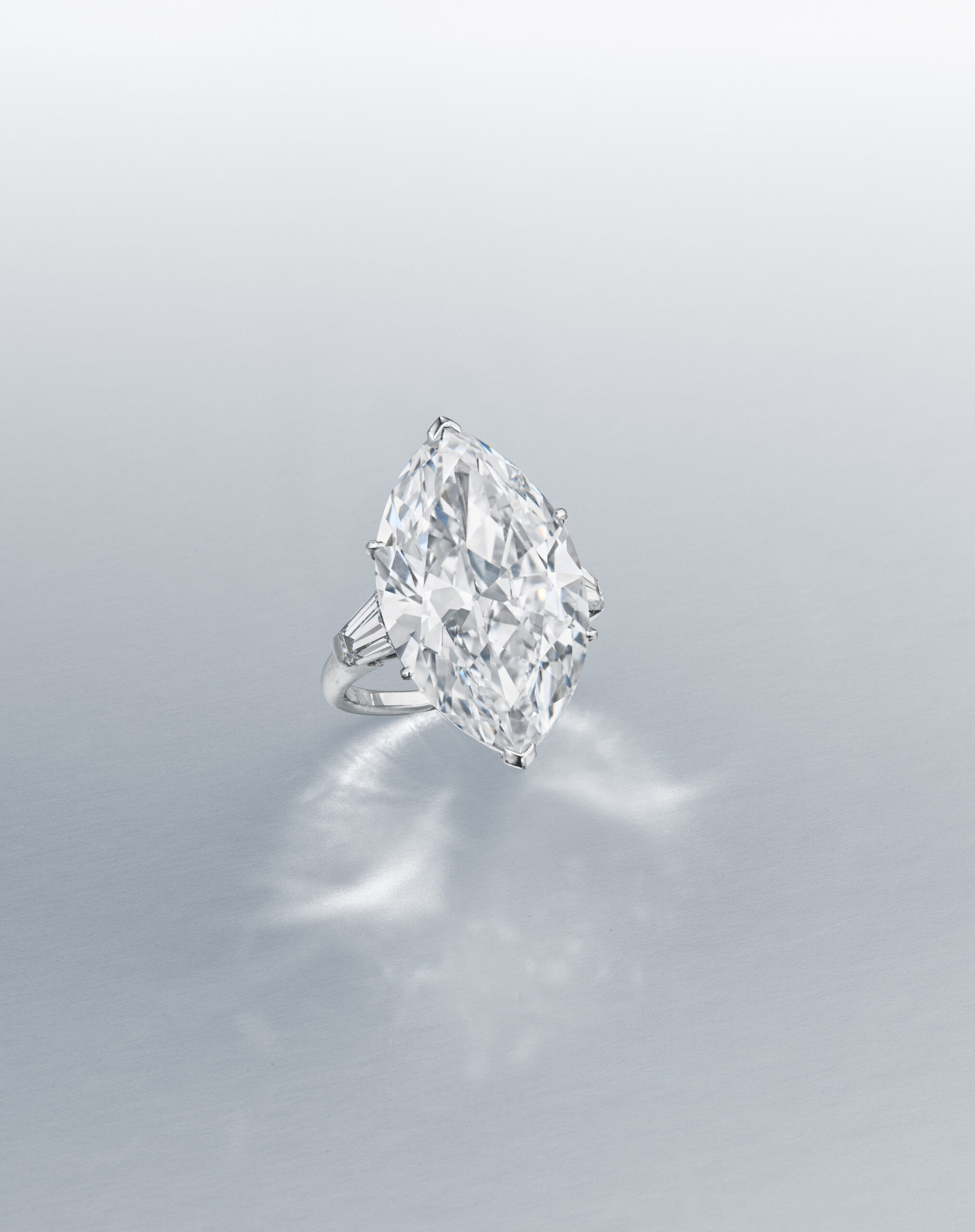 diamond-ring-modified-marquise-brilliant-cut-diamond-of-14-72-carats-tapered-baguette-cut-diamonds-platinum-1-850-000-front-view-primary.jpg 14.72 Carat Marquise Statement | Brilliant White | 18K Gold | Collector’s Grade Grandeur - Image 1