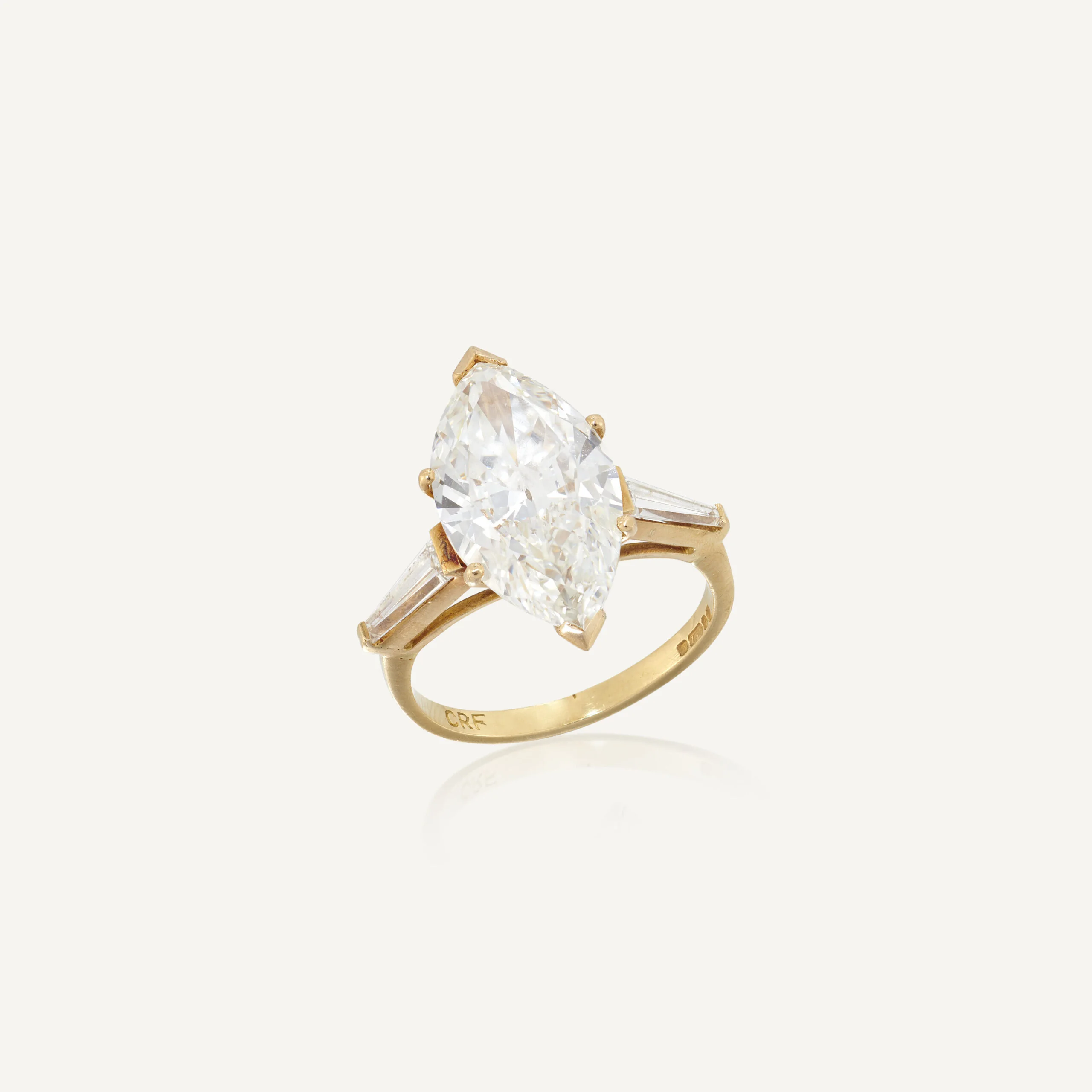 4.54 carat marquise diamond ring with tapered baguette shoulders in gold