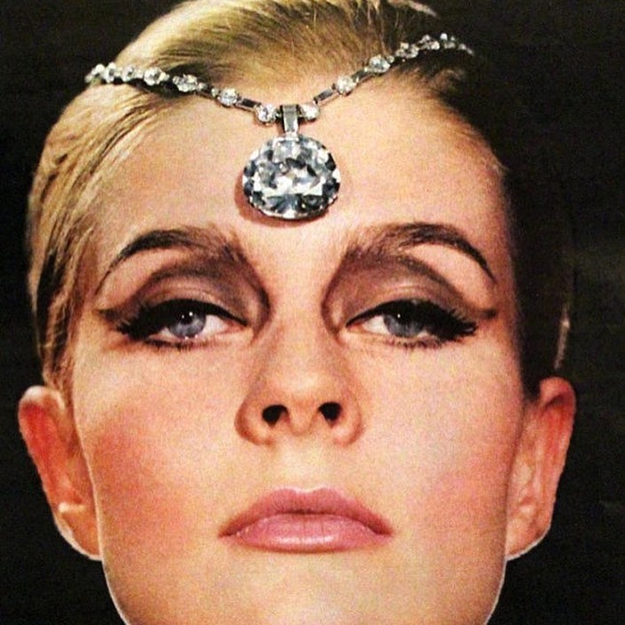 Woman wearing large carat diamond pendant headpiece – exceptional vintage fine jewellery