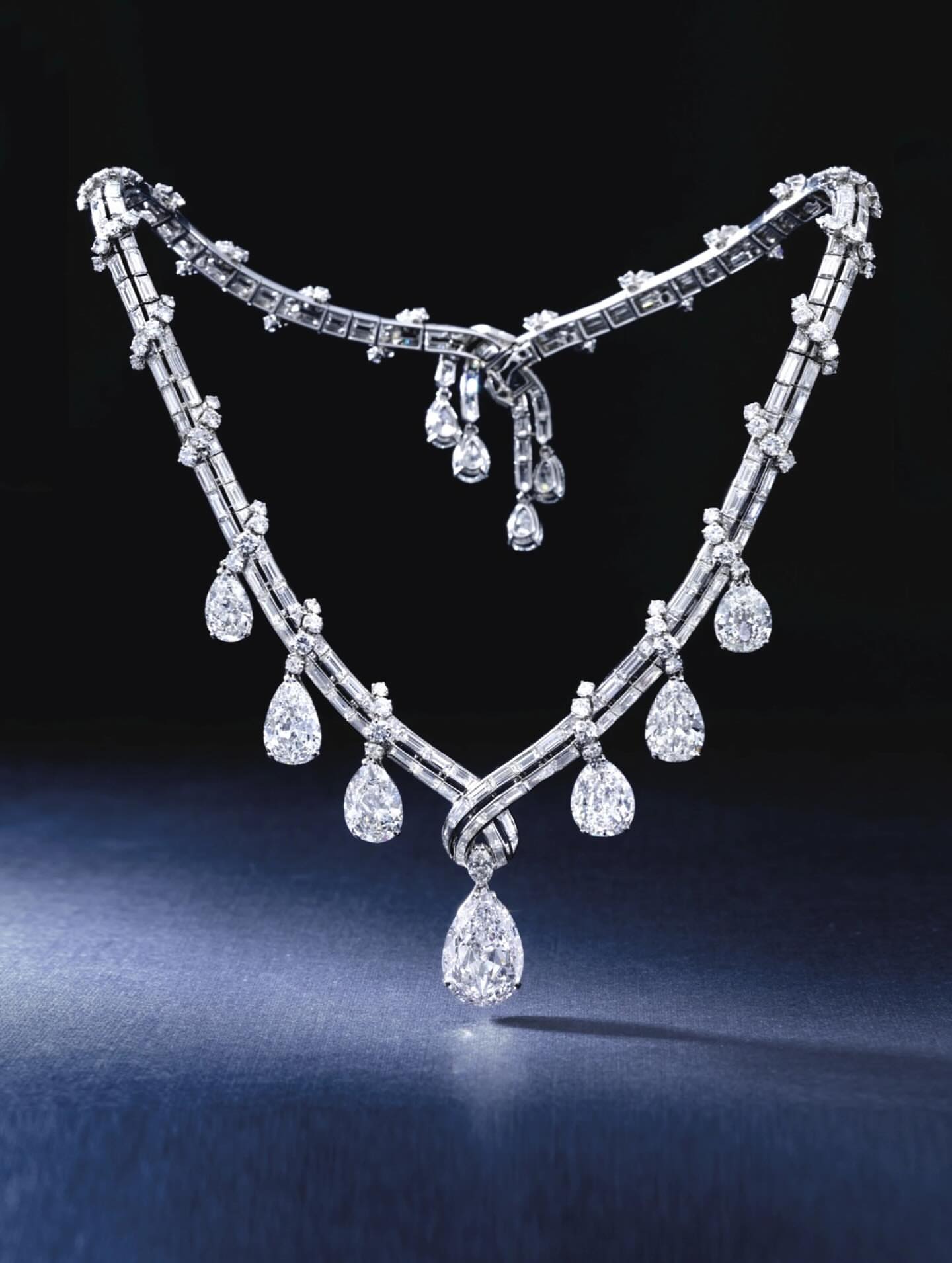 Large carat graduated pear-shaped diamond drop necklace on baguette diamond chain – exceptional fine jewellery