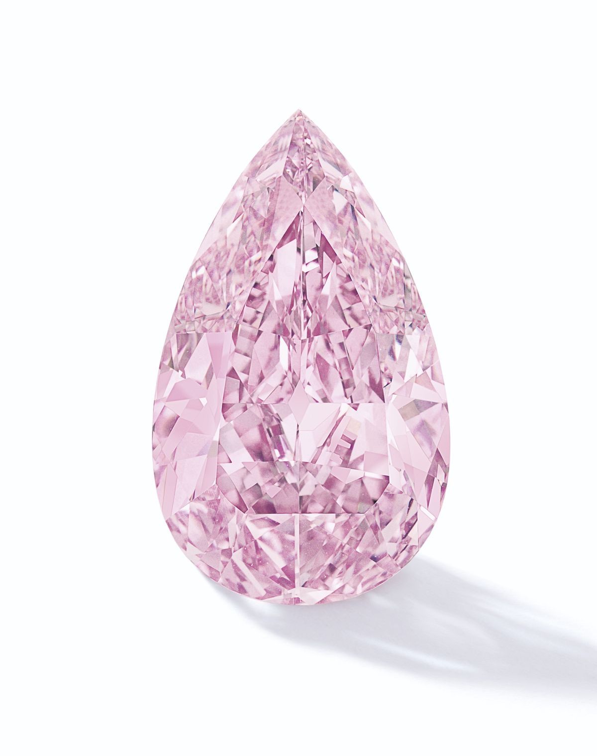5.22 carat Fancy Pink Pear Modified Brilliant Diamond, loose stone on white background