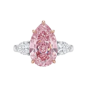 5.80 carat Fancy Pink Pear Diamond in three-stone ring with white diamond side stones