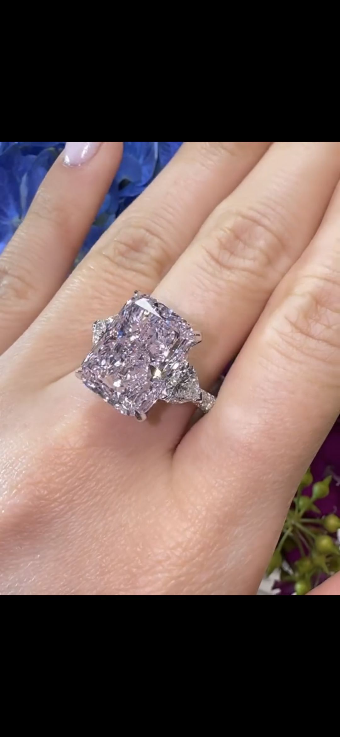 7.13 carat Light Pink Radiant Diamond set in ring, worn on hand