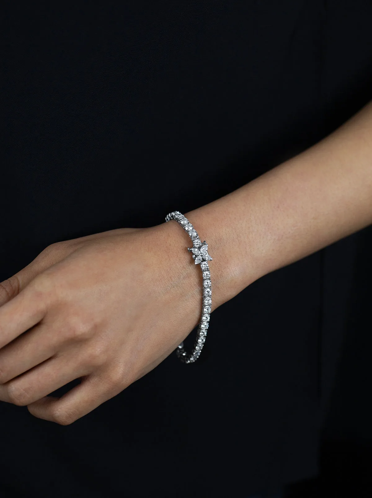 The Bracelet That Stopped the US Open 2. Closeup of platinum diamond tennis bracelet clasp with floral motif, 7.80 carats