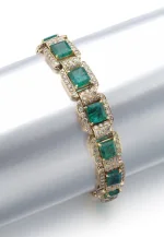 Emerald and Diamond Bracelet Each Link Set with a Step-cut Emerald Framed with Brilliant-cut Diamonds, Length Approximat