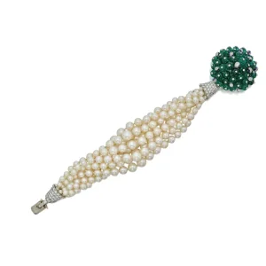 A Historically Important Cultured Pearl, Emerald, Diamond and Enamel Bracelet