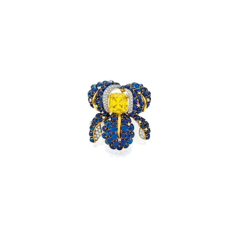 An Exceptional Fancy Vivid Yellow Diamond, Diamond and Sapphire Clip-brooch, | Designed As an Iris, Centering a Round-co