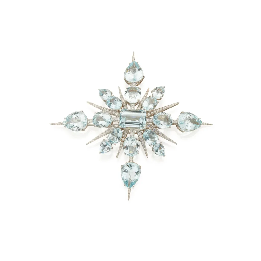 Aquamarine and Diamond 'star' Brooch of Sunburst Design, Centering an Emerald-cut Aquamarine, Radiating with Oval and Pe