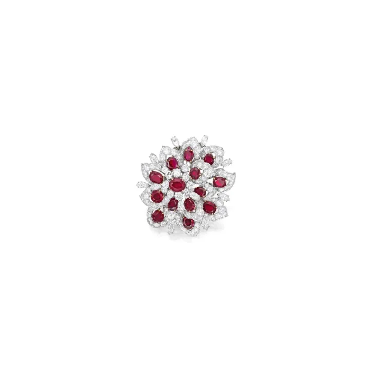 Ruby and Diamond Clip-brooch of Floral Design, Featuring Round and Oval-shaped Rubies, Framed and Accented by Round and