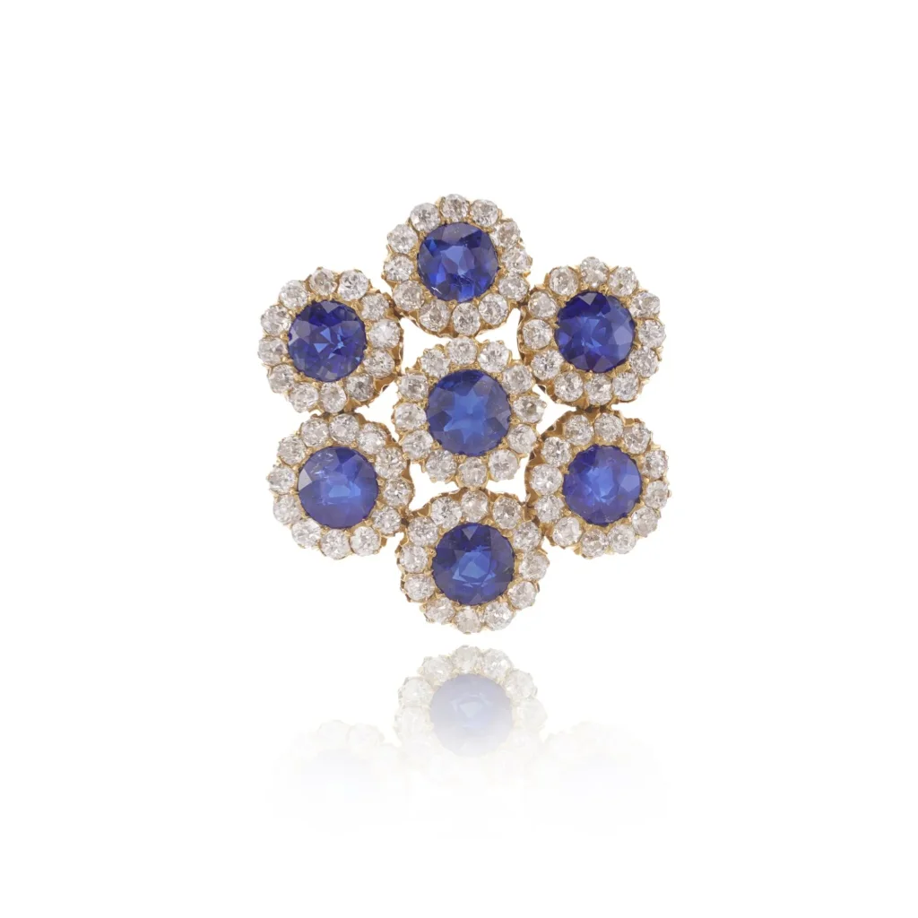Sapphire and Diamond Brooch, Circa 1910 Set with Round Sapphires, Each Within a Border of Circular-cut Diamonds