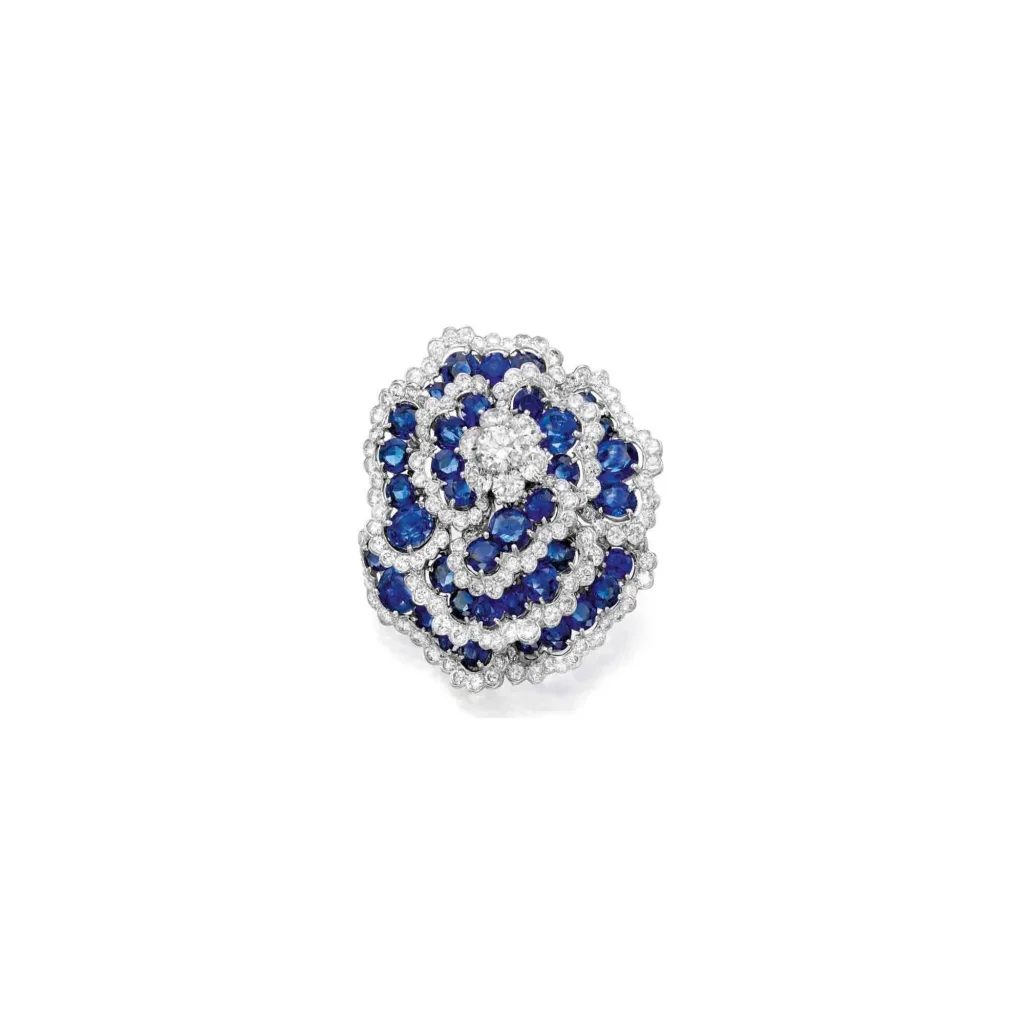 Sapphire and Diamond 'camellia' Clip-brooch | Designed As a Camellia, Set with Numerous Round Diamonds and Oval-shaped a