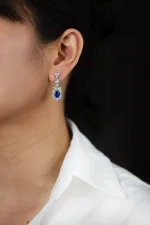 3.72 Carats Oval Cut Blue Sapphire and Diamond Halo Dangle Earrings in White Gold