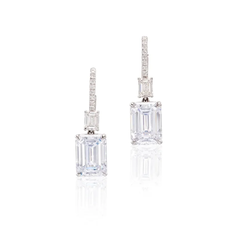 Pair of Diamond Pendent Earrings | Each Set with an Emerald-cut Diamond Weighing 5.05 and 5.01 Carats Respectively, Susp
