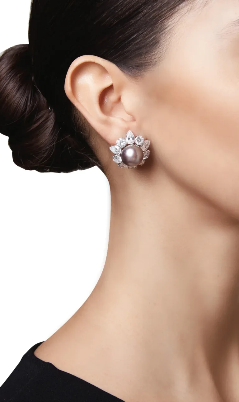 Pair of Natural Pearl and Diamond Earclips| Designed As Flowerheads, One Centering a Gray Natural Pearl Measuring Approx