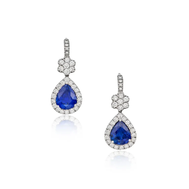 Pair of Sapphire and Diamond Pendant-earrings, France Centering Two Pear-shaped Sapphires, Framed and Accented by Round