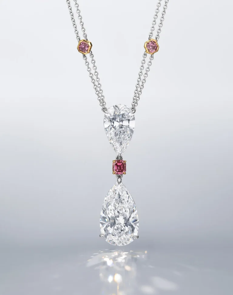 30 carats A SPECTACULAR DIAMOND AND COLOURED DIAMOND PENDENT NECKLACE Pear brilliant-cut diamond of 20.70 and 10.02 cara