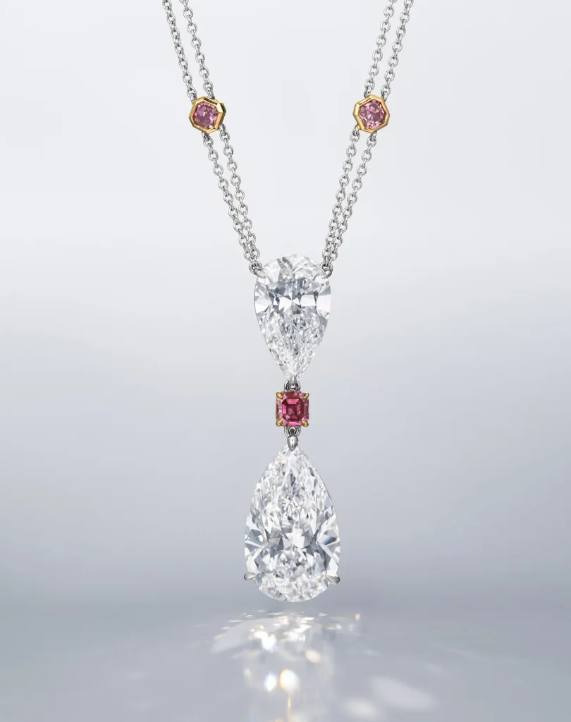 30 carats A SPECTACULAR DIAMOND AND COLOURED DIAMOND PENDENT NECKLACE Pear brilliant-cut diamond of 20.70 and 10.02 cara
