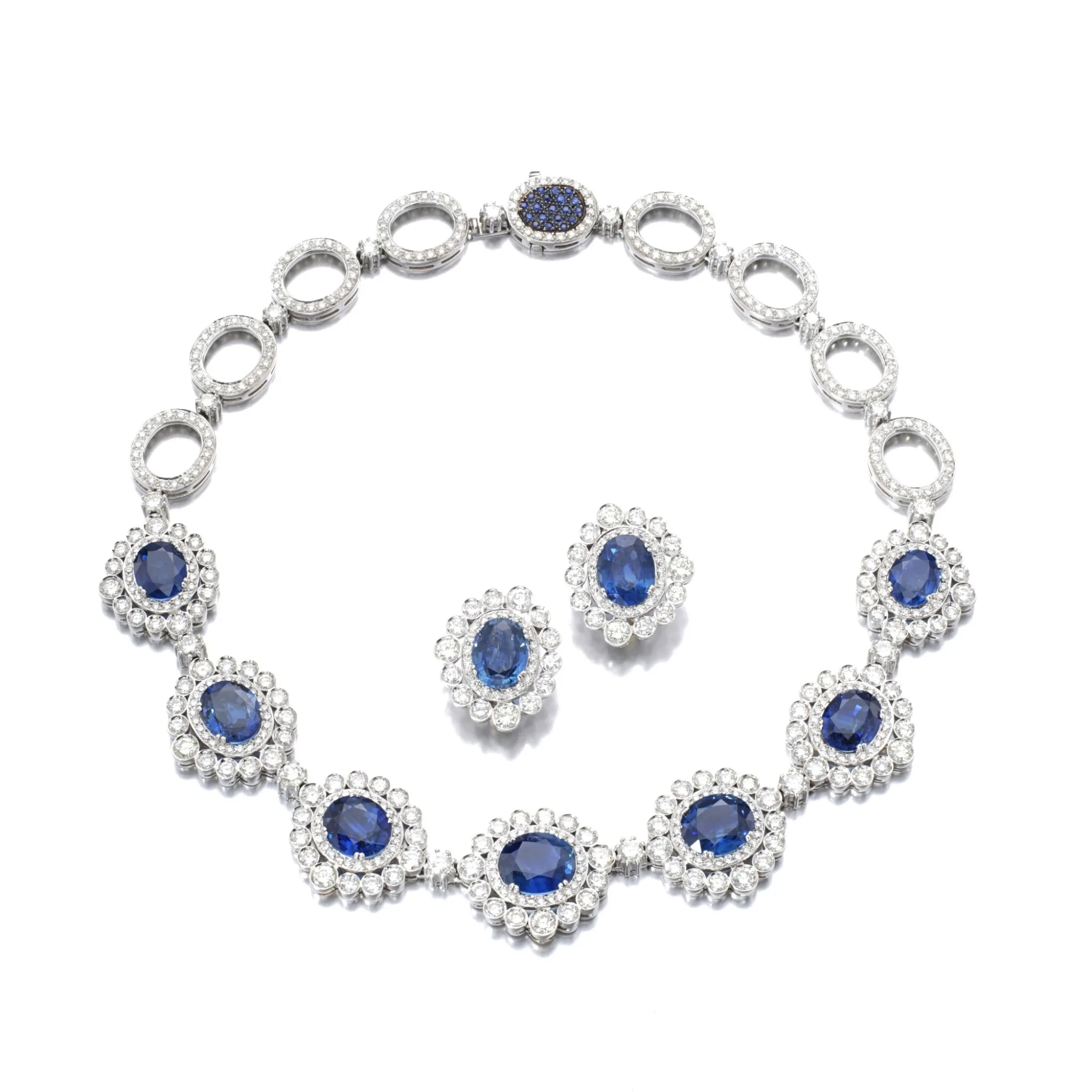 35 carats Sapphire and diamond demi-parure Comprising : a necklace of geometric design, the front set with oval sapphire