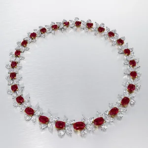 45 carats A MAGNIFICENT RUBY AND DIAMOND NECKLACE Twenty-six oval-shaped rubies of 5.38 to 1.27 carat, pear and marquise