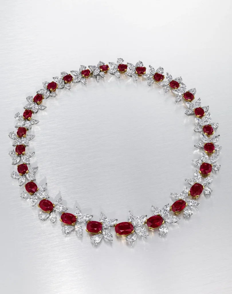 45 carats A MAGNIFICENT RUBY AND DIAMOND NECKLACE Twenty-six oval-shaped rubies of 5.38 to 1.27 carat, pear and marquise