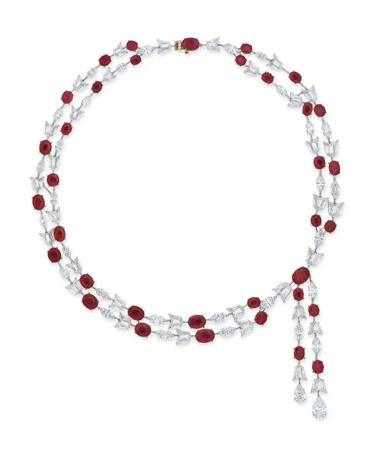 70 carats IMPORTANT RUBY AND DIAMOND NECKLACE, Thirty-five oval-shaped rubies, pear brilliant-cut diamond of 2.17 and 1.