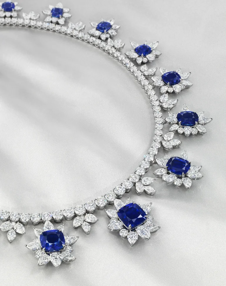 A MAGNIFICENT SAPPHIRE AND DIAMOND NECKLACE Sixteen antique cushion-shaped sapphires of 13.37 to 3.43 carats, variously-