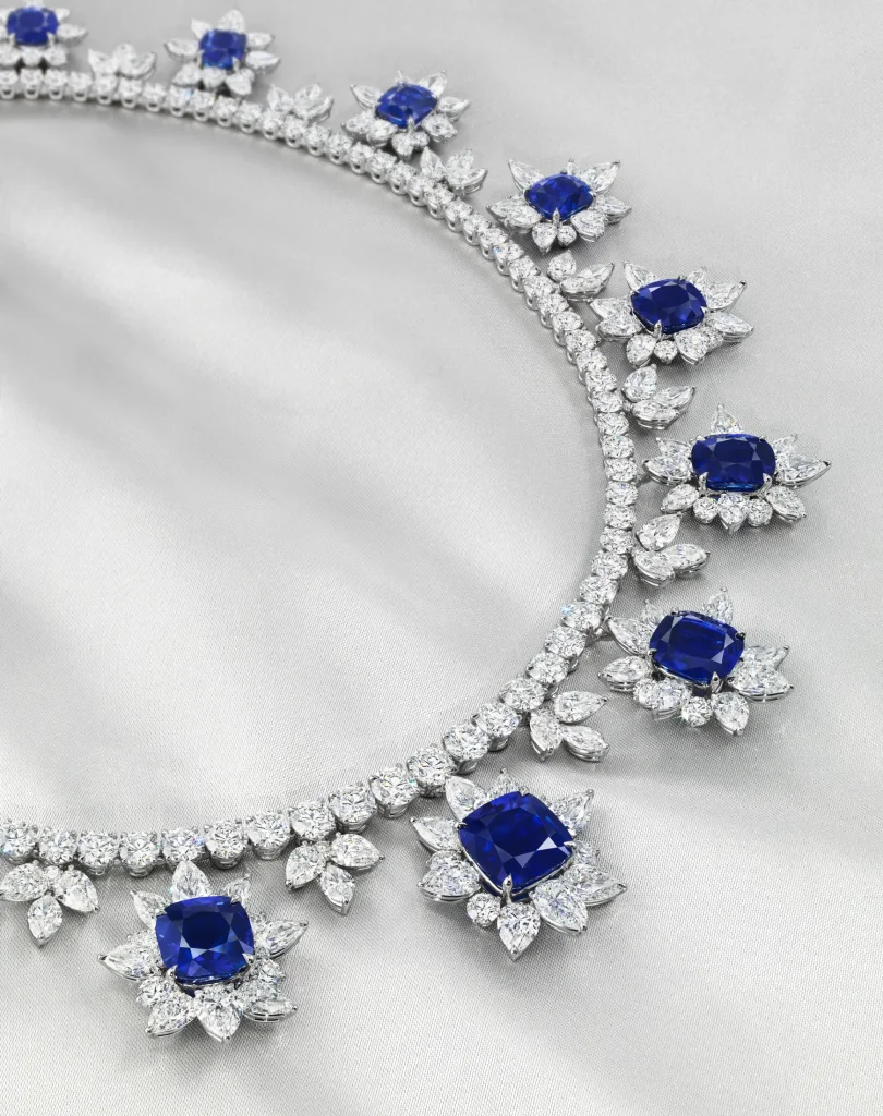 A MAGNIFICENT SAPPHIRE AND DIAMOND NECKLACE Sixteen antique cushion-shaped sapphires of 13.37 to 3.43 carats, variously-