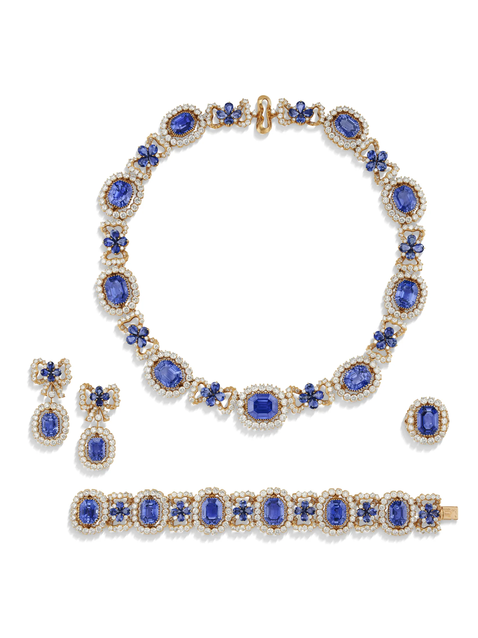 IMPRESSIVE SUITE OF SAPPHIRE AND DIAMOND 'NŒUD' JEWELLERY Comprising a necklace, a bracelet, a pair of earrings and a ri