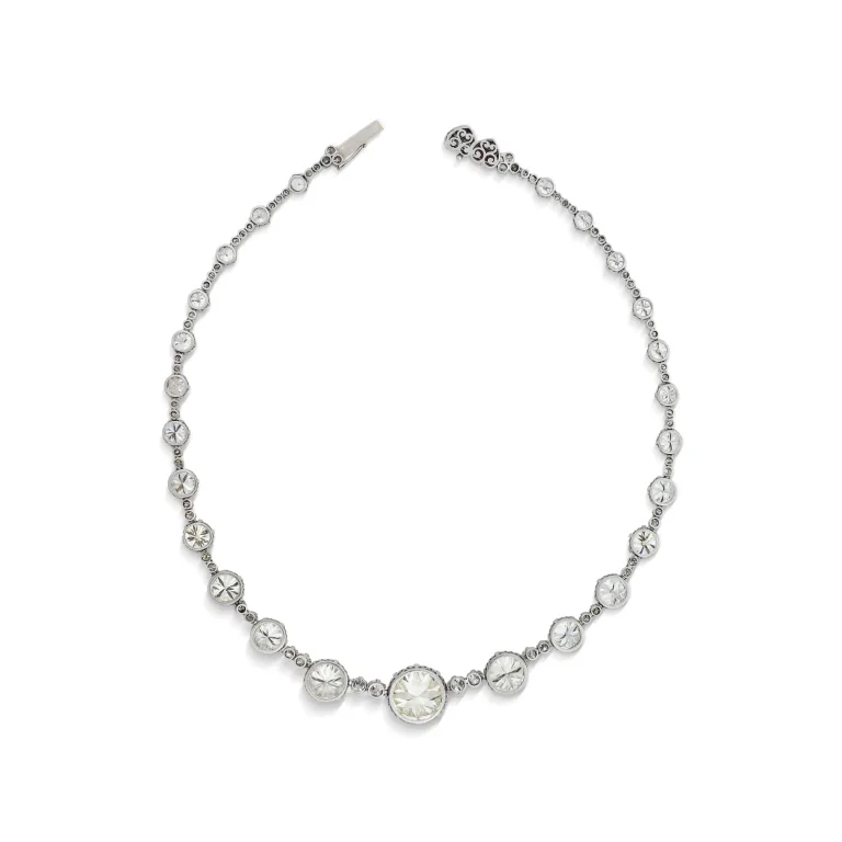MID-20TH CENTURY DIAMOND AND RUBY RIVIÈRE NECKLACE Circular brilliant-cut diamond of 11.91 carats, round and single-cut