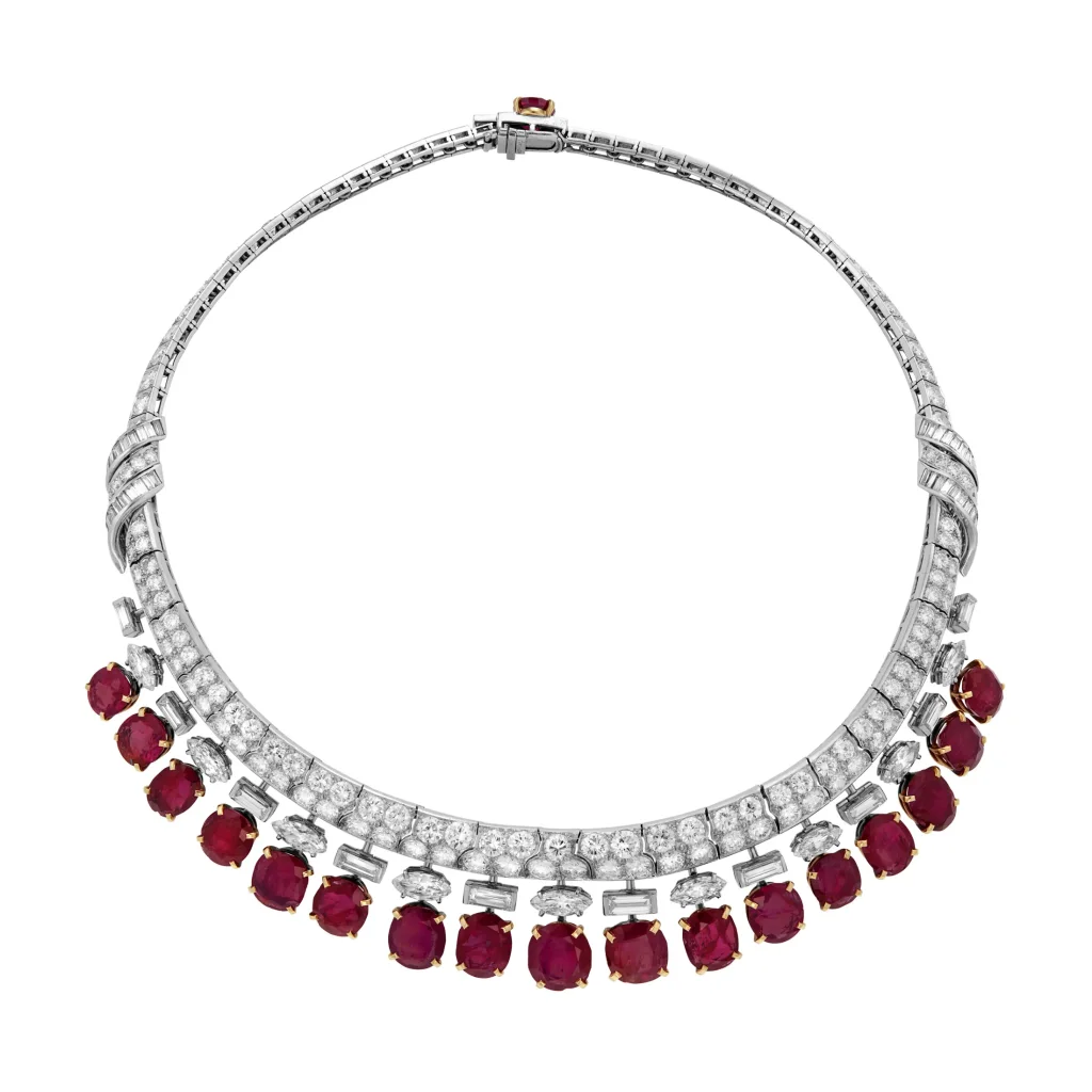RUBY AND DIAMOND NECKLACE Oval to cushion mixed-cut rubies, round, baguette and marquise-cut diamonds, platinum and yell