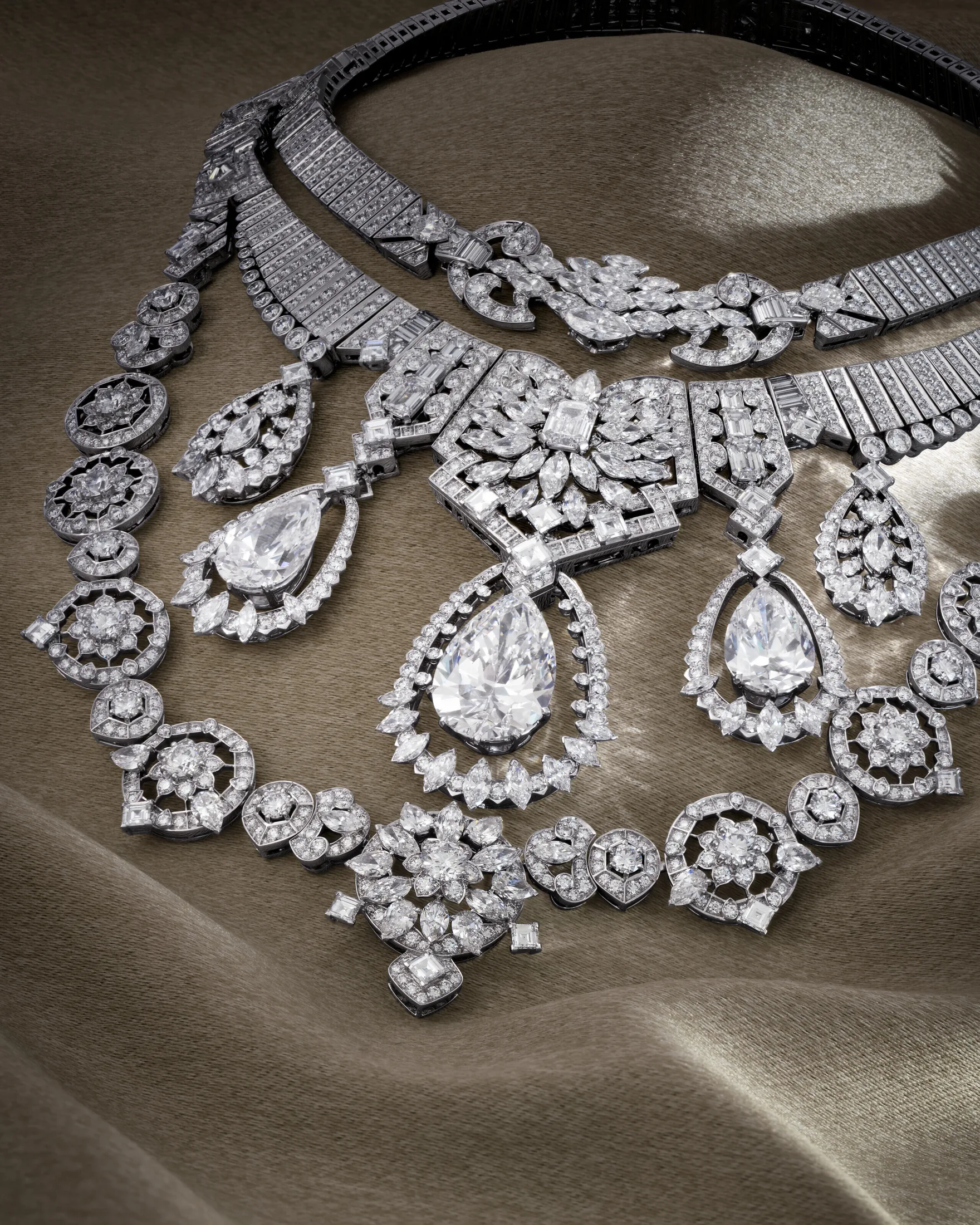 The Fifth C: Provenance 2. Closeup of graduated pear brilliant diamonds on a transformable court necklace